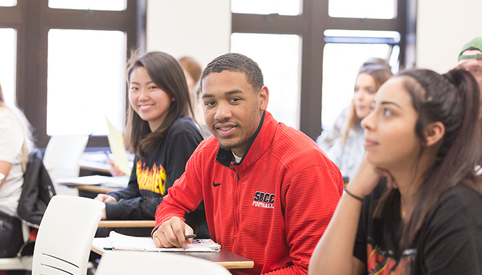 Three SBCC students sitting at desk