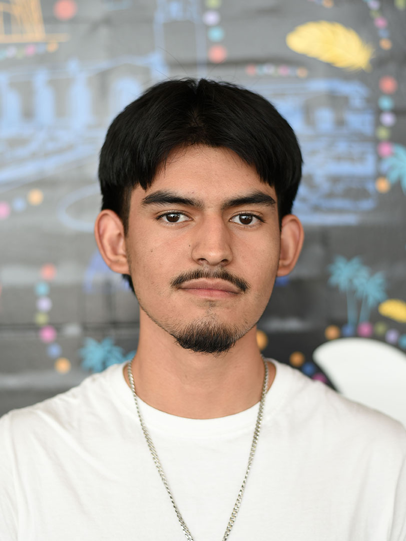A person with short hair and facial hair.