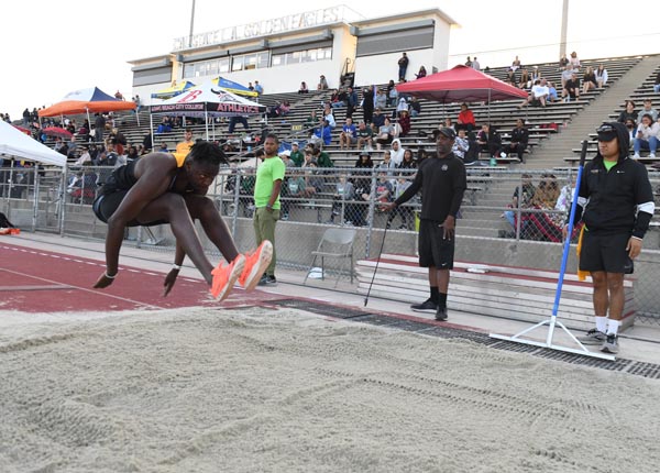 An athlete performing the long jump.