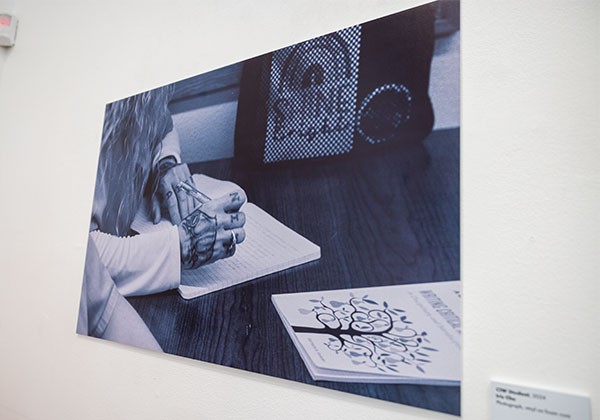 Portraint of inmates hand with a writing utensil as part of PGI