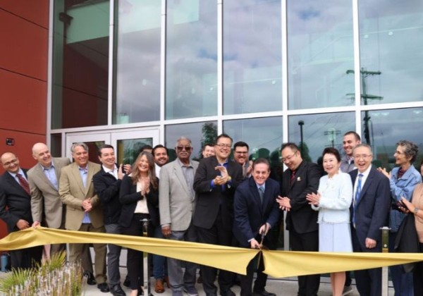 county officials and staff pose for ribbon ceremony 