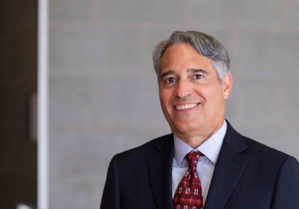 Man with red tie and dark blue suit 