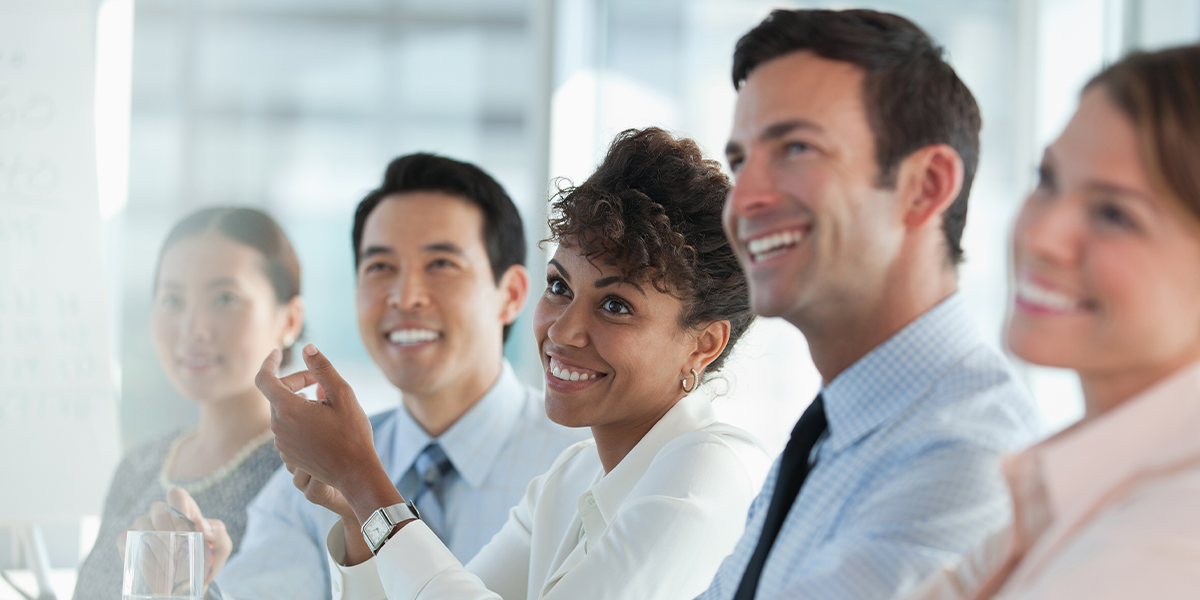 A happy business meeting in a bright room.