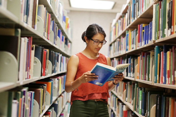 student reading in library