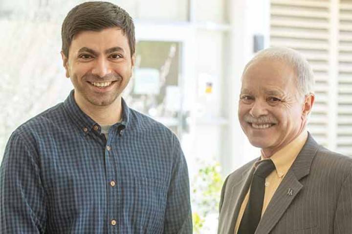 Lecturer Nidhin Patel (left) and Cal State LA President William Covino