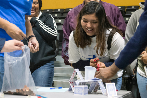 girl excitedly looks on experiment